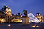 The night view of Cour Napoleon of Musee du Louvre with Pyramid Entrance in the background. Paris. France