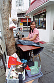 Tailor working on street, Bangkok, Thailand