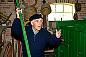 Guide in the farming museum, Oevenum, Foehr island, North Frisian Islands, Schleswig-Holstein, Germany
