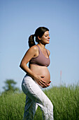 Pregnant woman in meadow