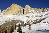 Skiers on a ski slope, Mountain landscape in Winter, Karerpass, Rosengarten Group, Eggental valley, South Tyrol, Italy