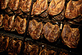 South Tyrolean Ham in the smoke house, South Tyrolean delicacy, Gostner Schwaige, Alp, South Tyrol, Italy