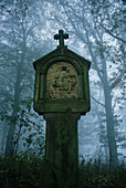 Cross in the woods, Eifel, Rhineland Palatinate, Germany