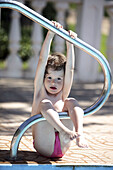 4 years old girl in swimming-pool.