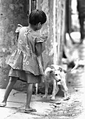 Girl and dog, Calcutta, India