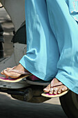 Delhi, India: woman in sari on a motorbike