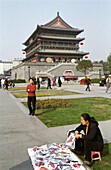 The kite seller in front of the drum tower in the city of Xian, China