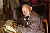 Portrait of a Chinese man, street scene in a small town in Shanxi, China