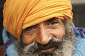 A portrait of a smiling sikh man in Amritsar, India