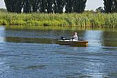 Angler in a boat on the river Havel near Ketzin, Brandenburg, Germany
