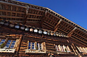 Row of cow bells, mountain restaurant Aebi, Adelboden, Bernese Oberland, Canton of Berne, Switzerland