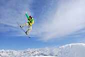 Snowboarder in mid-air, ski area Soelden, Oetztal, Tyrol, Austria