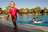 Little child, girl, at the swimming pool, Lamaya Resort, Coraya, Marsa Alam, Red Sea, Egypt