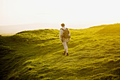 Solitary hiker on Eggardon Hill, Dorset, Uk / MR 6422