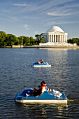 USA, Washington, D.C.  Tourists float along on a paddle boat on the tidal basin.