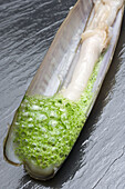 Razor shell with parsley and garlic foam at restaurant El Mercadito by Gonzalo Rey, Santiago de Compostela. La Coruña province, Galicia, Spain