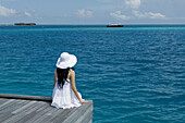 Womon Sitting on Ocean, Maldives