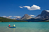 Tourists Canoeing on Bow Lake, Icefields Parkway, Alberta, Canada