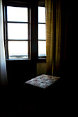 Curtain and stool at the window of a hotel room, Belgrade, Serbia, Europe