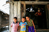 Sea gypsies, Moken boys at a hut, Mergui Archipelago, Andaman Sea, Myanmar, Burma, Asia