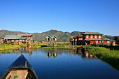 Village with stilt houses of the Intha people under blue sky, Inle Lake, Shan State, Myanmar, Burma, Asia