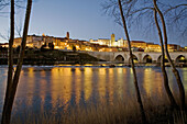 Medieval bridge and Duero river at dusk, Tordesillas. Valladolid province, Castilla-Leon, Spain