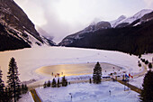 View of the ice skating rink on Lake Louise from the Fairmont Chateau Lake Louise Hotel, Alberta, Canada