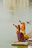 Women at holy lake, India