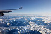 View through airplane window over Rocky Mountains, Oregon, USA