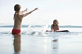 Two girls bathing in Lake Starnberg, Bavaria, Germany