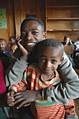 ETHIOPIA  Urban development project of the Daughters of Charity, Kabille 18, Addis Ababa  The project helps poor people with disabilities and health problems  Father and son at the center