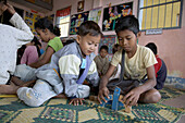 Cambodia  Childrens Center at Anlon Kgnan  Young children playing with toys