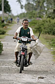 INDONESIA  Transport by motor-cycle, Meulaboh, Aceh, two years after the Tsunami