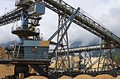Canada, BC, Port Mellon  Howe Sound Pulp & Paper Mill  Wood chip piles and converyor system