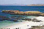 Family on Port na Ba beach near Tobermory, Isle of Mull, Scotland, UK