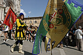 Siena Italy, flag-weavers of the Contrada del Bruco in front of the Dome during the Palio