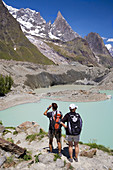 Hikers. Mountain in Glacier Miage in the massif of Mont Blanc or Monte Bianco in the Italian Alps. Italy, Europe.