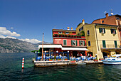 Restaurant at lakeshore, Malcesine, lake Garda, Veneto, Italy