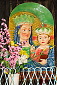 Shrine with picture depicting the virgin Mary and Jesus wearing crowns, decorated with artifical flowers, Mottarone, Stresa, lake Maggiore, Lago Maggiore, Piemont, Italy