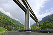 Road passing beneath the motorway bridge, Gotthard highway near Giornico, valley Leventina, Ticino, Switzerland