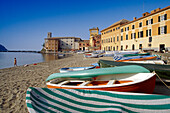 Boats on the beach at Baia del Silenzio bay in the sunlight, Sestri Levante, Liguria, Italian Riviera, Italy, Europe