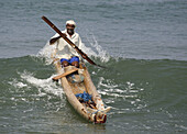 Fisherman in canoe, Kovalam, Kerala, India