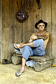 Alexaner Erasmos de Moraes, Fazendero de Caroebe, Roraima. Sitting in one of the huts in his lands. Brazil.