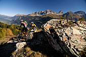 Couple on a mountain bike tour, MTB, mountainbiking near Svognin, View towards Albula Range, Grisons, Switzerland