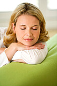 Woman relaxing with eyes closed