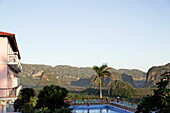 Swimming pool, Hotel los Jazmines, Mogotes in background, Vinales, Pinar del Rio, Cuba, West Indies