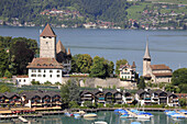 palais Spiez an the church of the holy Kolumban at Lake Thun,  Niedersimmental,  canton Bern,  Switzerland