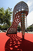 Scultpure of shoe made with saucepans by Joana Vasconcellos in Passeig de Gracia, Barcelona. Catalonia, Spain