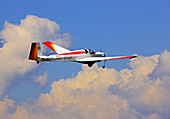 Powered glider about the clouds