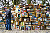 A man looking for a book on the street